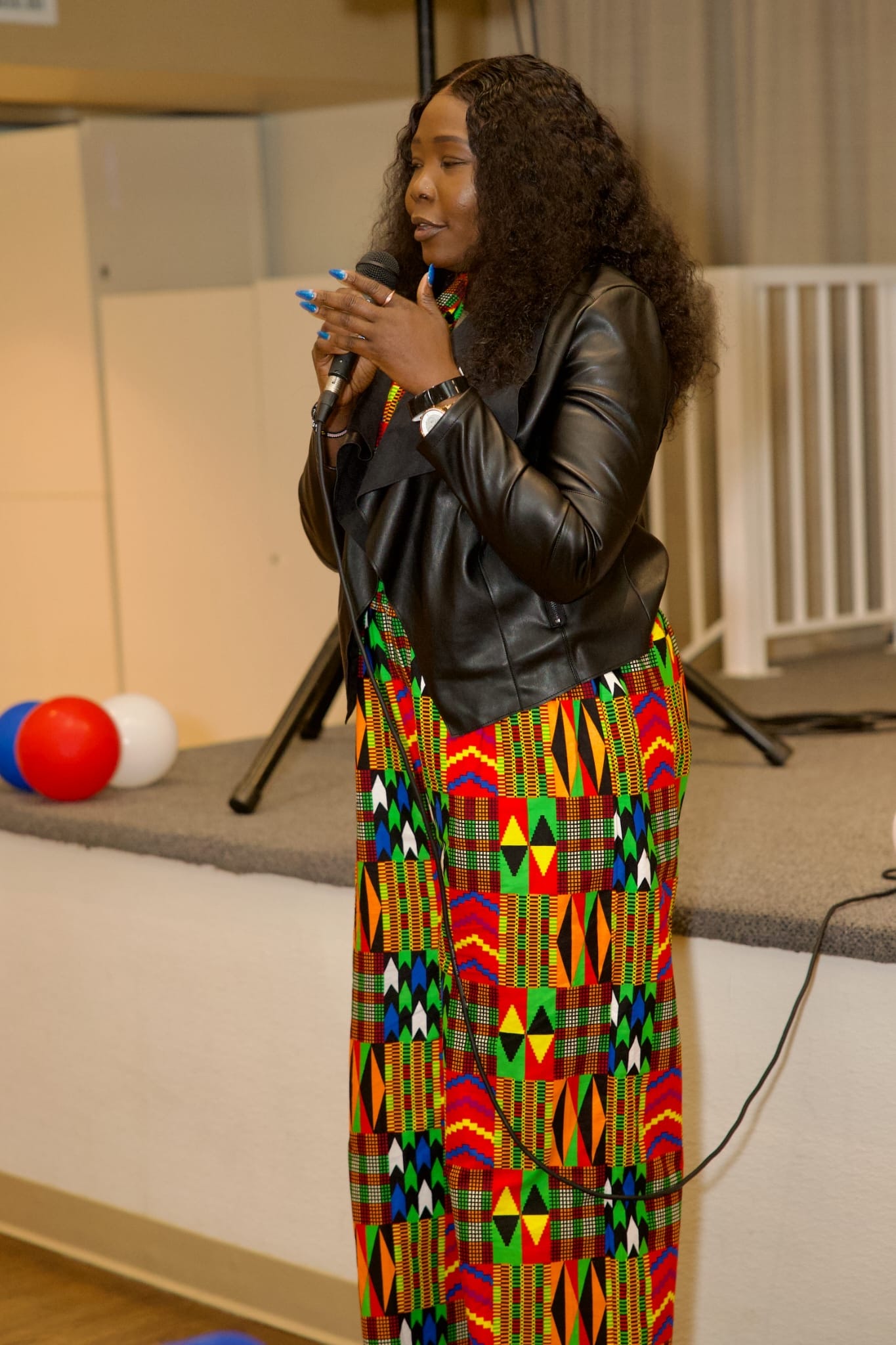 Speaker in traditional attire at W.A.C.A.BC event